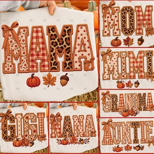 May include: A white t-shirt featuring various family titles like MAMA, MOM, MIMI, GRANDMA, GIGI, NANA, and AUNTIE in block letters. The letters have patterns including red plaid, leopard print, polka dots, and floral designs with orange bows.