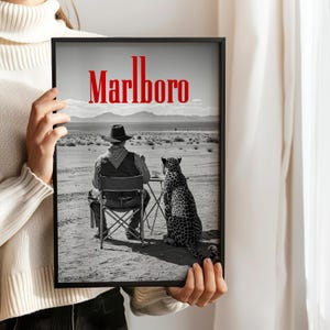 Black and white Marlboro cowboy and cheetah poster, retro western wall art print for vintage home decor and mancave decoration.