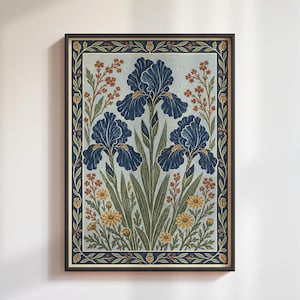 May include: A framed rectangular wall art print featuring a central illustration of three dark blue iris flowers with green stems and leaves, surrounded by smaller yellow and orange wildflowers, all enclosed within a dark blue decorative border.