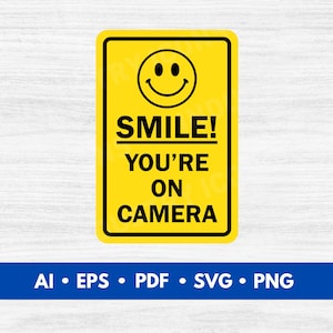 May include: A yellow rectangular sign with a black border and a smiling face icon. The sign reads "SMILE! YOU'RE ON CAMERA" in bold black letters. Below the sign is a blue banner with file type icons.