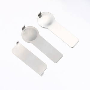 May include: Three silver metal watch case back openers. The openers are shaped like a spoon with a round end and a small tab on the side.