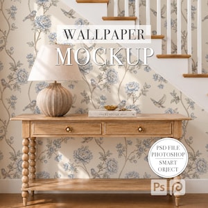 May include: A wallpaper mockup featuring a light beige background with a blue floral and bird pattern. A wooden console table with two drawers and a ribbed lamp sits in front of the wall. The text WALLPAPER MOCKUP and PSD FILE PHOTOSHOP SMART OBJECT appear.