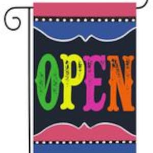 May include: A black garden flag with a white border and a red and blue border. The flag says "OPEN" in colorful letters.