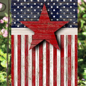 May include: A red, white, and blue American flag garden flag with a large red star in the center. The flag is made of wood and has a distressed look.