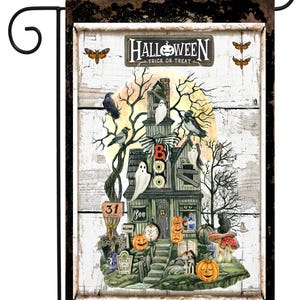 May include: Halloween garden flag featuring a spooky haunted house with ghosts, pumpkins, and crows. The flag has a distressed wood background and reads "Halloween Trick or Treat". Includes a black metal garden flag holder.