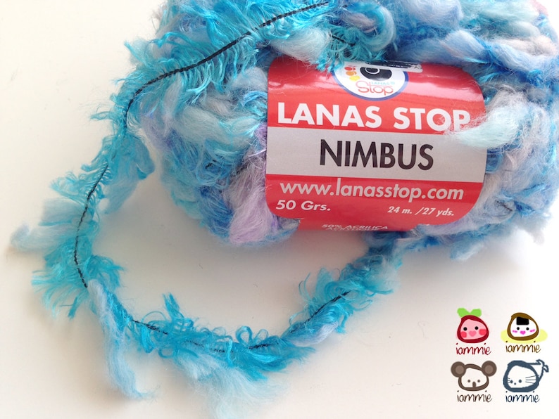 May include: A skein of blue, white, and purple yarn with a fluffy texture. The yarn is labeled "LANAS STOP NIMBUS" and includes the website address "www.lanasstop.com". The skein is 50 grams and 24 meters long, or 27 yards.