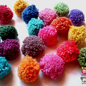 May include: A collection of colorful pom-poms in various shades of blue, green, red, pink, purple, orange, and yellow. The pom-poms are made of yarn and are soft and fluffy.