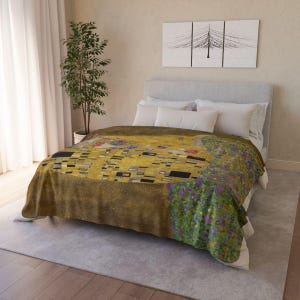 May include: A gold and brown duvet cover featuring a reproduction of Gustav Klimt's "The Kiss", a painting of two figures embracing.