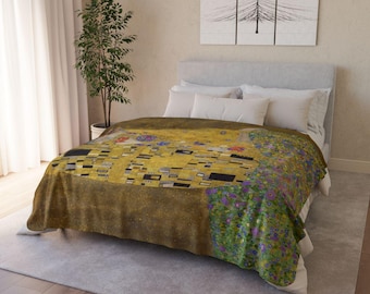 May include: A gold and brown duvet cover with a painting of two figures embracing. The painting is a reproduction of Gustav Klimt's "The Kiss".
