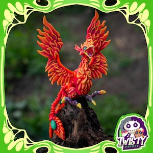 May include: A vibrant, detailed sculpture of a phoenix, perched on a piece of wood. The bird is predominantly red and orange, with yellow accents. The phoenix has outstretched wings and an open beak. The sculpture is set against a blurred green background.