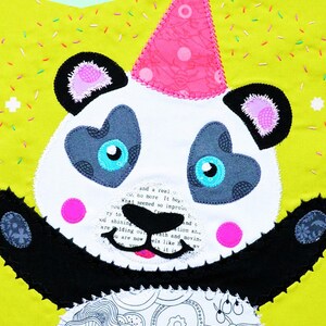 May include: A handmade panda bear mini quilt with a party hat. The panda has heart-shaped eyes and pink accents on a lime green background. The text "PANDORA Mini Quilt - Cushion - Tote" is visible.