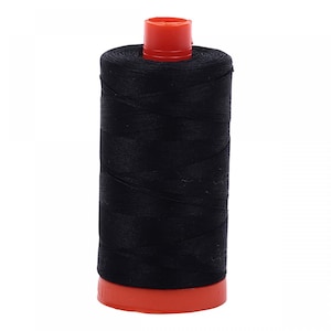 May include: A black thread spool with a red top and base. The thread is tightly wound, forming a cylindrical shape. This sewing supply is suitable for various crafting and sewing projects.