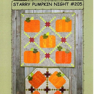 May include: A quilted wall hanging featuring two pumpkin-themed designs. The top piece is rectangular with six orange pumpkins and red stars on a gray background. The bottom piece is an octagon with four pumpkins. The text "Suzanne's Art House" and "Starry Pumpkin Night #205" are visible.