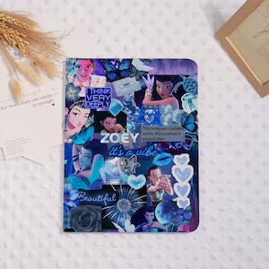 May include: A notebook with a collage design featuring illustrations of a woman, butterflies, and text. The text includes "ZOEY", "it's a vibe", "Beautiful", and "I THINK VERY DEEPLY". The color scheme is primarily blue.