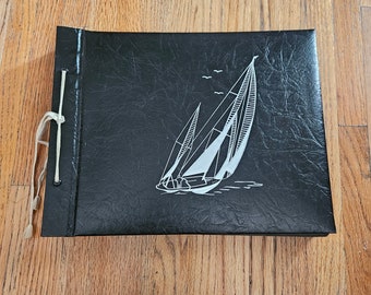 Vintage 1950s  black leather? With sailboat photo album