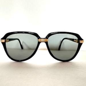 Gafas de sol Cartier Vitesse vintage 1991 doradas y negras