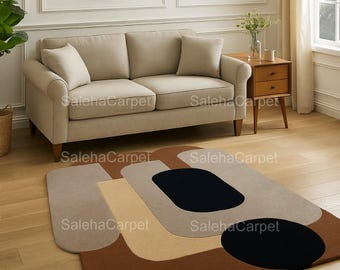 Alfombra abstracta de lana tejida a mano: alfombra de diseño moderna con forma orgánica en tonos marrón y beige.