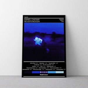 May include: Album cover art for Daniel Caesar's album "Never Enough". The cover features a blue and black color scheme with a silhouette of a person in a white shirt standing in a field. The album title is printed in white text at the top of the cover.