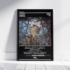 May include: A black and white album cover for the album "Impera" by the band "Ghost". The album cover features a large, metallic, skeletal figure with a crown on its head. The album title is written in gold lettering at the top of the cover. The album was released on March 11, 2022.