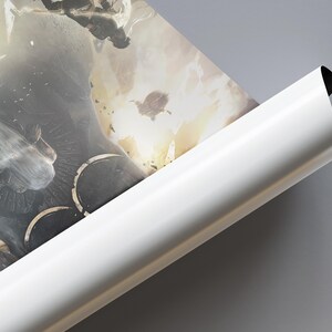 May include: A rolled poster displaying a fantasy scene with figures in flight, set against a backdrop of a celestial event. The artwork has a dark, dramatic colour palette with highlights of gold and white.