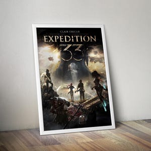 May include: A framed poster featuring the text "CLAIR OBSCUR EXPEDITION 33" with a fantasy art scene. The artwork depicts several figures in a dramatic landscape with a large, ominous structure in the background. The poster is in a white frame.