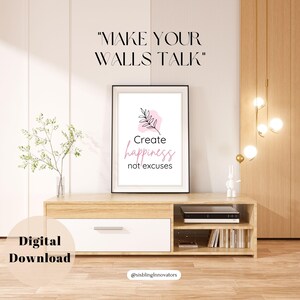 May include: A digital download of a printable wall art print with a pink and black design. The print features the text "Create happiness not excuses" with a small leaf illustration. The text "Make your walls talk" is at the top of the image.