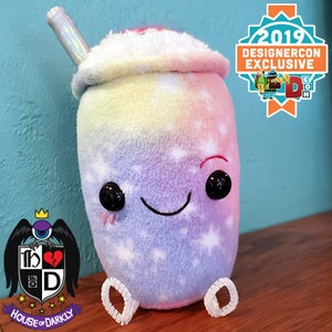 Celestial Plush Latte pastel coffee with whipped cream, star sprinkles, holographic straw