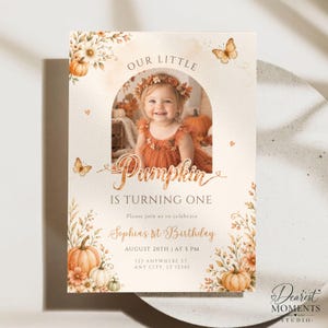 May include: A rectangular birthday invitation card featuring a central arched photo of a child in an orange dress. The text reads Our Little Pumpkin Is Turning One, Sophias 1st Birthday, August 20th at 5 PM, 123 Anywhere St, Any City, ST 12345.