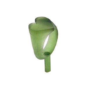 May include: A white ceramic mug with a black handle and the text "But First, Coffee" in a bold, black font. The mug is set against a neutral background, highlighting its simple design.