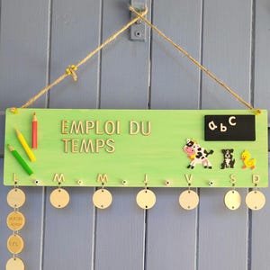 Wooden timetable for children. Can be personalized with the child&#39;s name. Useful, fun, and decorative back-to-school item.