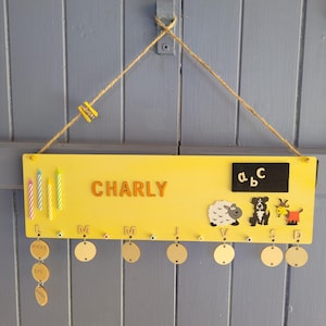Wooden timetable for children. Can be personalized with the child&#39;s name. Useful, fun, and decorative back-to-school item.