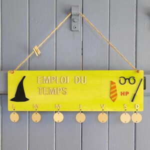 Wooden timetable for children. Can be personalized with the child&#39;s name. Useful, fun, and decorative back-to-school item.