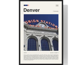 May include: A vintage poster with a minimalist design featuring a photograph of Union Station in Denver, Colorado. The poster has a blue and white color scheme with the text "Denver" and "Union Station" in bold, black lettering.