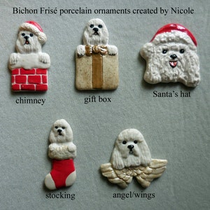 May include: A collection of Bichon Frisé porcelain ornaments. The ornaments include a dog in a Santa hat, a dog in a chimney, a dog in a gift box, a dog in a stocking, and a dog with angel wings. The text "Bichon Frisé porcelain ornaments created by Nicole" is at the top.
