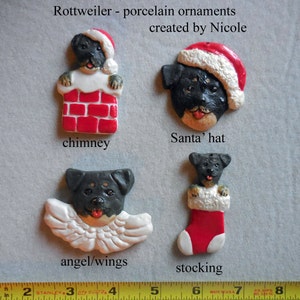 May include: Four Rottweiler porcelain ornaments. One is a black and tan dog in a red chimney, another in a Santa hat, a third with angel wings, and the last in a red stocking. Text reads "Rottweiler - porcelain ornaments created by Nicole."