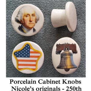 May include: Set of four porcelain cabinet knobs. One knob features George Washington, another the Liberty Bell, and a third with a star-shaped American flag design. The fourth knob is a plain white design.