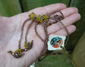 Escargots sheer yellow glass beaded flowers  and snails  Handmade in France jewelry French Beading
