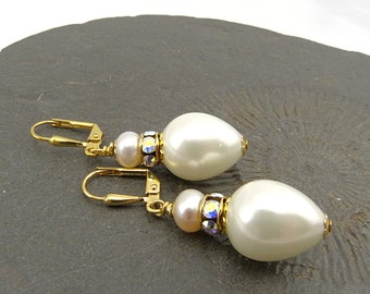 White pearl drops and Swarovski rondelles, gold-plated elements. Festive earrings, bridal jewelry, shell core, crystals, nickel free