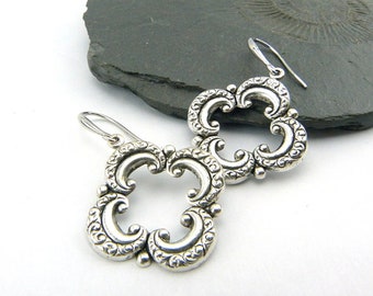 Silver arabesques - filigree embossed earrings. Patinated, silver-plated, oriental-looking earrings with stamped elements. Nickel free