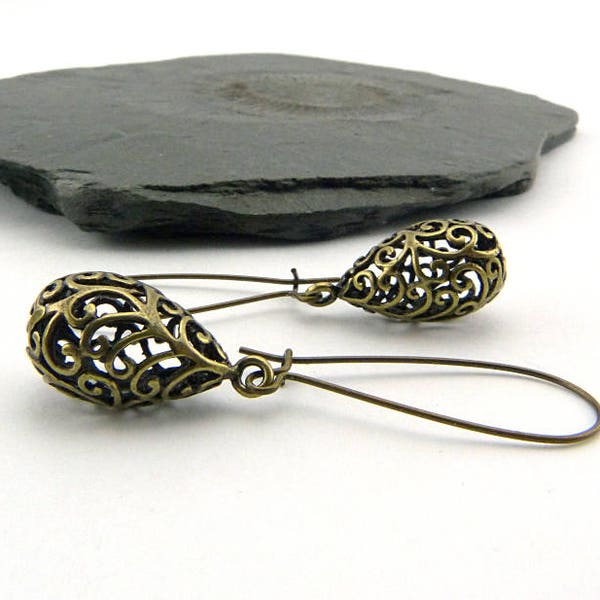 Delicate filigree drops on long ear hooks. Vintage style, romantically playful earrings, boho style, simple, nickel-free, summer jewelry.