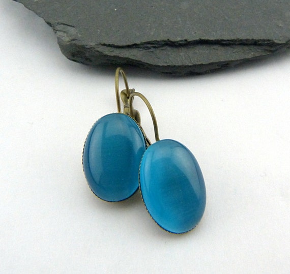 sparkly and feminine. Blue Sparkle Drops Shiny Faceted Glass Drop Earrings with silver accent and gunmetal french earwires