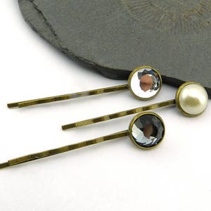 Romantic hair clips: sparkling crystals, shimmering glass pearl. Antique brass, nickel-free. 12 mm cabochons, wedding hair accessories.