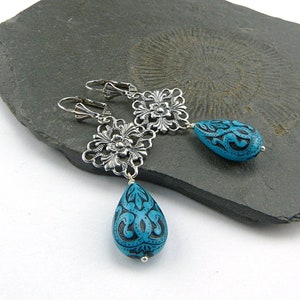Filigree silver, bright turquoise. Long drop earrings with delicately decorated drops in turquoise blue and black. Winter jewelry. image 3