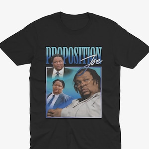 May include: Black t-shirt with a vintage-style graphic featuring three men and the text "PROPOSITION Joe".