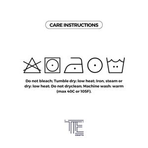 May include: Care instructions for a garment: Do not bleach, tumble dry low heat, iron low heat, machine wash warm (max 40C or 105F).