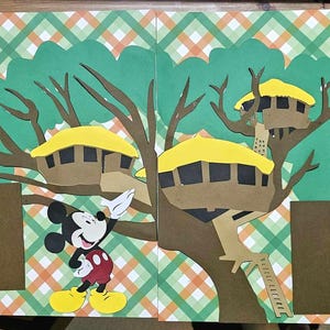 May include: A scrapbook page with a treehouse theme. The page features a tree with three treehouses, Mickey Mouse, and the text "Swiss Family Treehouse". The background has a green and orange plaid pattern, with brown photo boxes.