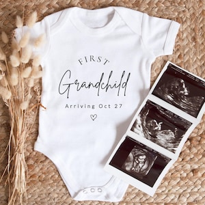 a baby's first grandchild bodysuit next to a picture of a baby