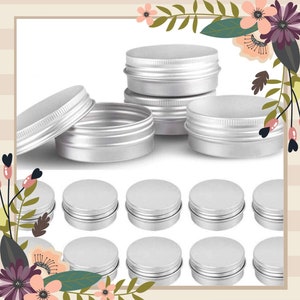 May include: A set of 10 silver metal round containers with lids. The containers are stacked on top of each other.