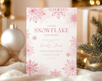 Könnte beinhalten: Eine Babyparty-Einladung mit Schneeflocken-Motiv. Die Einladung hat einen hellrosa Hintergrund mit rosa Schneeflocken-Illustrationen. Der Text lautet "A Little Snowflake Is On The Way" und enthält den Namen "Emily Jones" sowie Datum und Uhrzeit der Veranstaltung.