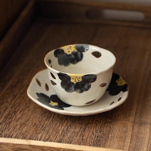 Tokoname stoneware cup and saucer with floral motif